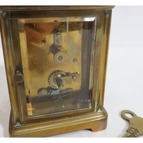 263 - A 19th century French brass carriage clock with white enamel dial and roman numeral chapter ring, wi... 