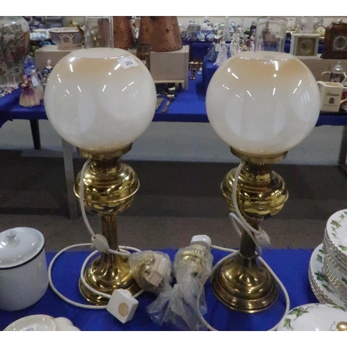 283 - A pair of brass oil lamps with opaque graduated glass shades (electrified)