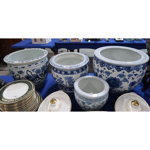 294 - Three large Chinese blue and white fish bowls and another smaller