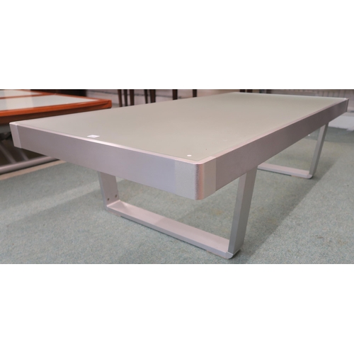 112 - A modern aluminium and glass topped coffee table, 35cm high x 130cm long x 65cm deep 