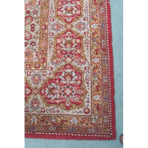 120 - A 20th century beige ground Axminster style rug with a red central medallion and border, 356cm long ... 