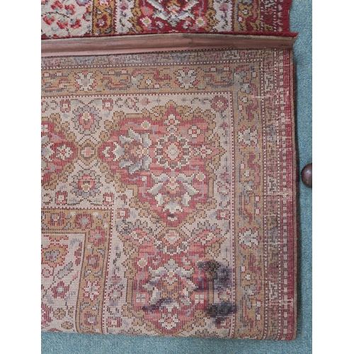 120 - A 20th century beige ground Axminster style rug with a red central medallion and border, 356cm long ... 