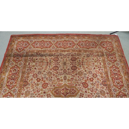 120 - A 20th century beige ground Axminster style rug with a red central medallion and border, 356cm long ... 