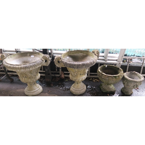 134 - A pair of reconstituted stone garden urns and two other garden planters (4)