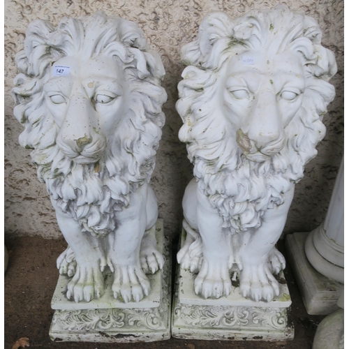 147 - A pair of contemporary stone ware garden lions, 79cm high (2)