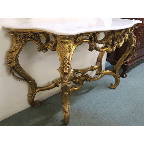 47 - A 20th century serpentine marble top gilt Rococo style console table, 83cm high x 131cm wide x 57cm ... 