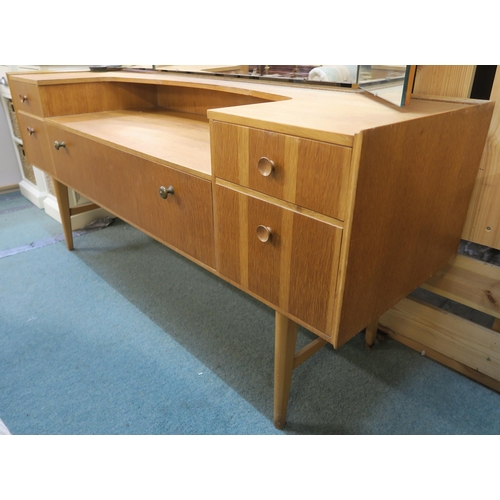 71 - A mid 20th century teak Meredew triple mirror dressing table with central drawer flanked by two draw... 