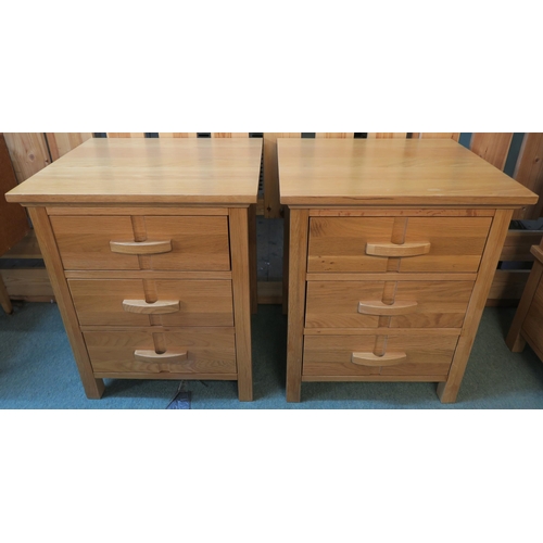 72 - A pair of modern white oak three drawer bedside chests, 66cm high x 54cm wide x 47cm deep (2)