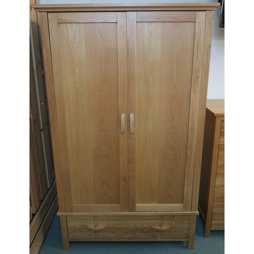 73 - A modern white oak wardrobe with two doors above single drawer, 190cm high x 115cm wide x 58cm deep