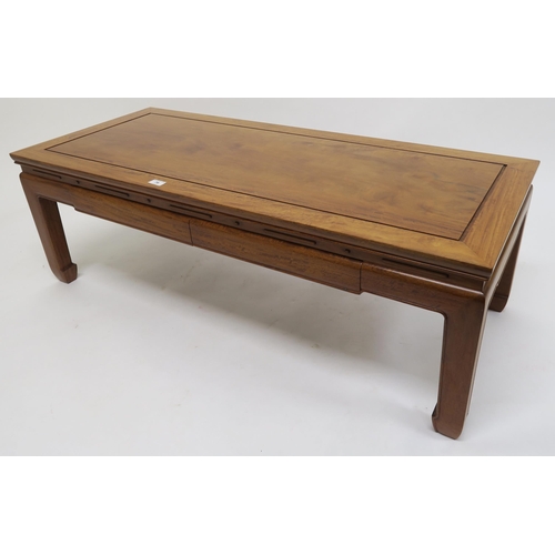 79 - A contemporary hardwood oriental style two drawer coffee table, 40cm high x 122cm wide x 51cm deep