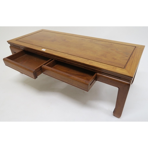 79 - A contemporary hardwood oriental style two drawer coffee table, 40cm high x 122cm wide x 51cm deep