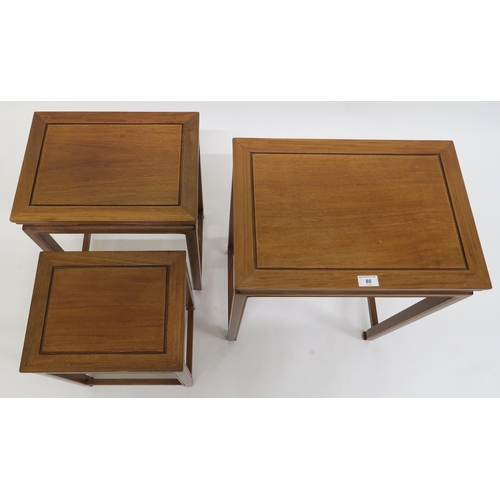 80 - A contemporary hardwood oriental style nest of three tables, 67cm high x 49cm wide x 35cm deep