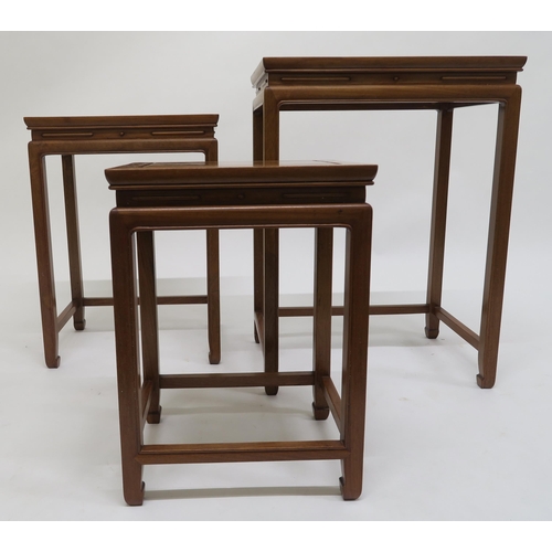 80 - A contemporary hardwood oriental style nest of three tables, 67cm high x 49cm wide x 35cm deep