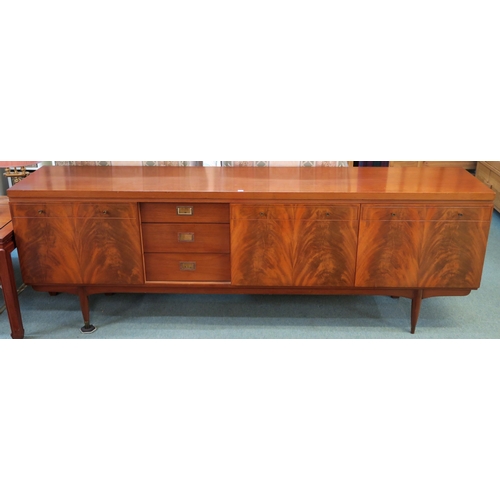 82 - A mid 20th century teak Greaves & Thomas sideboard on turned supports, 76cm high x 220cm wide x ... 