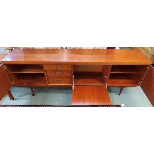 82 - A mid 20th century teak Greaves & Thomas sideboard on turned supports, 76cm high x 220cm wide x ... 