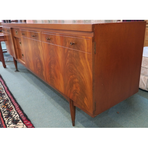 82 - A mid 20th century teak Greaves & Thomas sideboard on turned supports, 76cm high x 220cm wide x ... 