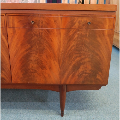 82 - A mid 20th century teak Greaves & Thomas sideboard on turned supports, 76cm high x 220cm wide x ... 