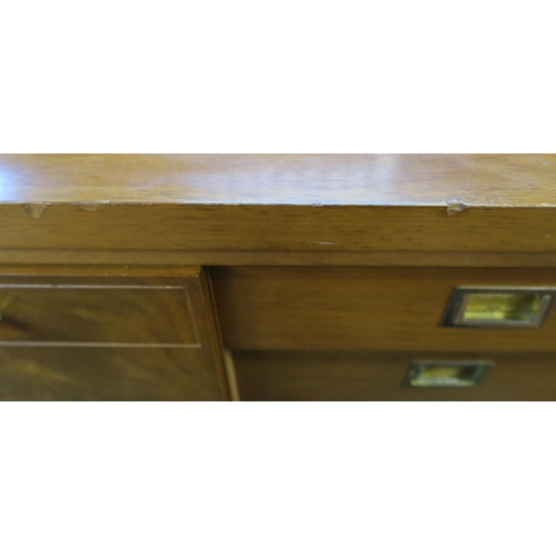 82 - A mid 20th century teak Greaves & Thomas sideboard on turned supports, 76cm high x 220cm wide x ... 