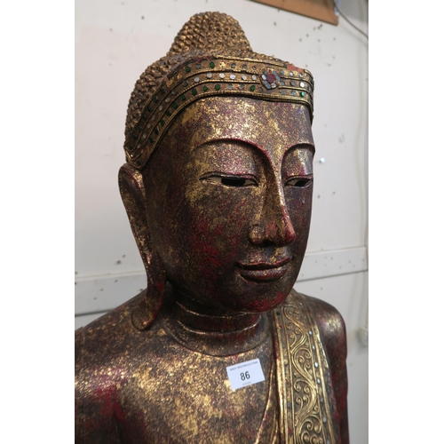 86 - A 20th century painted wooden statue of the Buddha, 191cm high