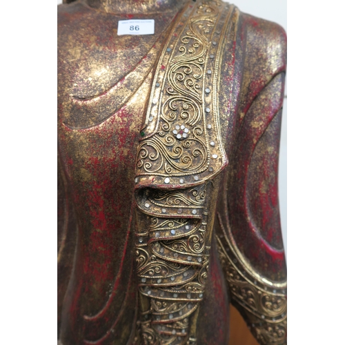 86 - A 20th century painted wooden statue of the Buddha, 191cm high