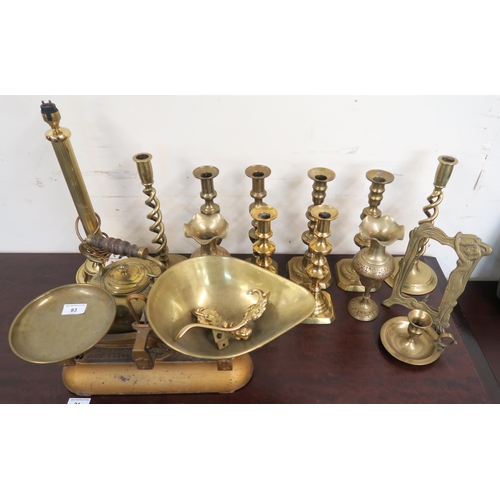 93 - A lot of brassware to include four pairs of candle sticks, scales etc