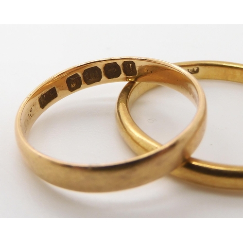 528 - An 18ct gold Birmingham 1915 hallmarked wedding ring, size M, an 18ct gents wedding ring size T1/2, ... 