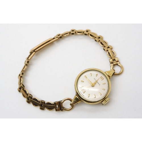 538 - A ladies gold plated Hugenin watch with a 9ct gold strap, weight approx of the strap 7gms