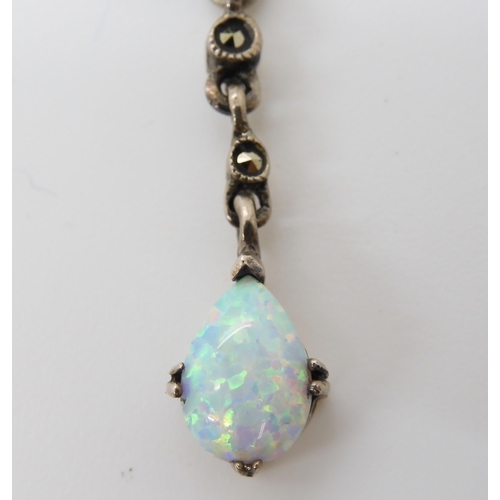 548 - A silver Victorian style imitation opal and marcasite pendant 7.4cm x 3.2cm, weight 11.2gms