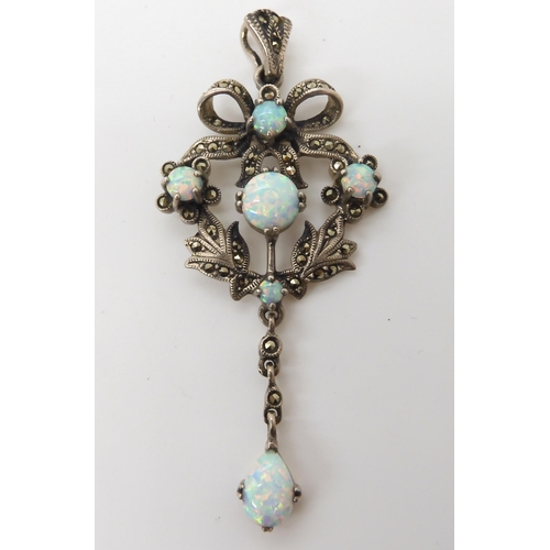 548 - A silver Victorian style imitation opal and marcasite pendant 7.4cm x 3.2cm, weight 11.2gms