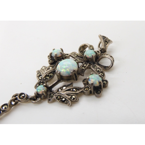 548 - A silver Victorian style imitation opal and marcasite pendant 7.4cm x 3.2cm, weight 11.2gms