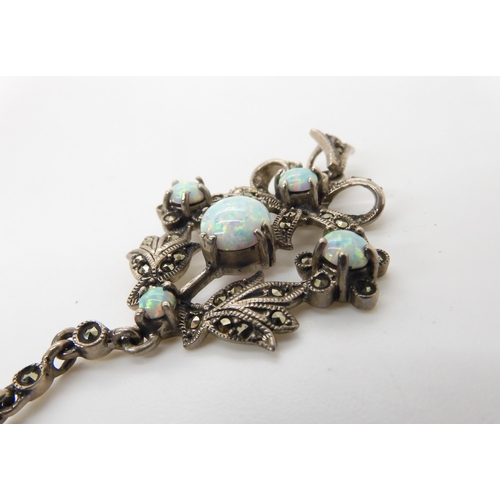 548 - A silver Victorian style imitation opal and marcasite pendant 7.4cm x 3.2cm, weight 11.2gms