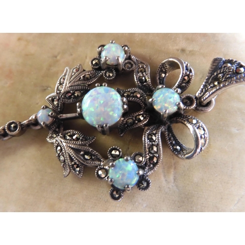 548 - A silver Victorian style imitation opal and marcasite pendant 7.4cm x 3.2cm, weight 11.2gms