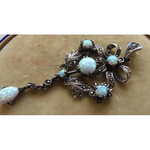 548 - A silver Victorian style imitation opal and marcasite pendant 7.4cm x 3.2cm, weight 11.2gms