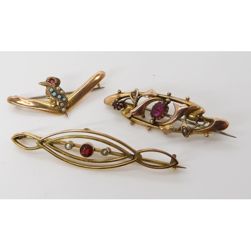 555 - A 9ct gold gem set Kookaburra and boomerang brooch, together with two 9ct gold pearl and gem set bro... 