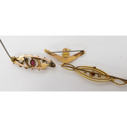 555 - A 9ct gold gem set Kookaburra and boomerang brooch, together with two 9ct gold pearl and gem set bro... 