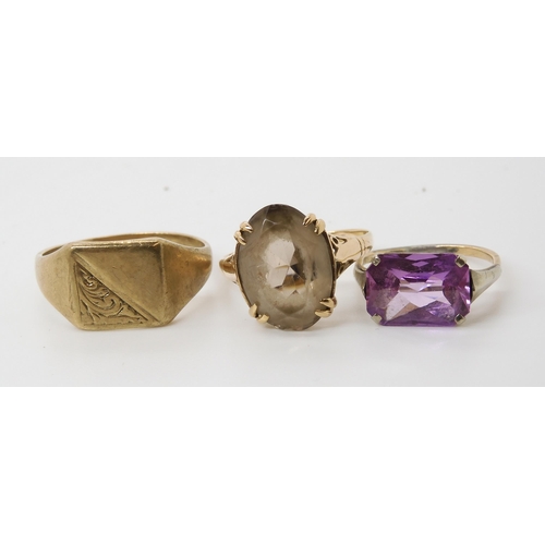 557 - A 9ct signet ring, size R1/2, and two further 9ct gem set rings, weight combined 7.8gms