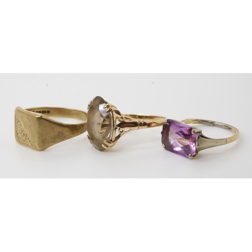 557 - A 9ct signet ring, size R1/2, and two further 9ct gem set rings, weight combined 7.8gms