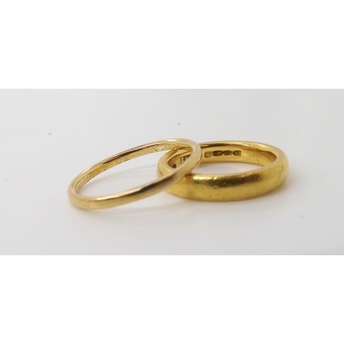 560 - A 22ct gold wedding ring with Birmingham hallmarks for 1870, size L, weight 6.7gms, together with a ... 