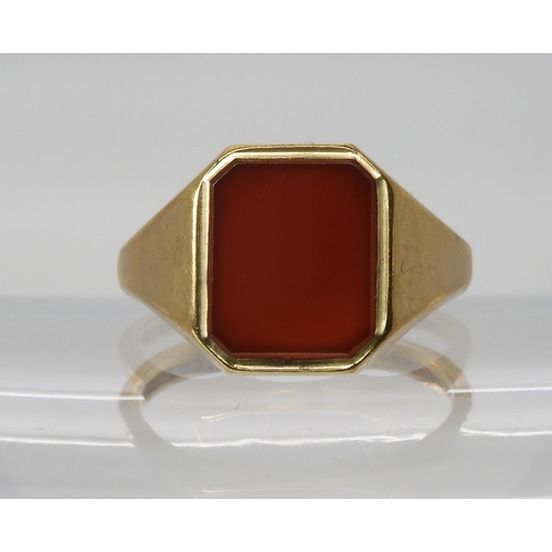 564 - A 9ct gold carnelian signet ring, size U1/2, weight 5.9gms