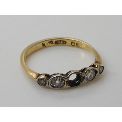 566 - An 18ct gold diamond ring (one diamond missing) the four remaining diamonds have an estimated diamon... 