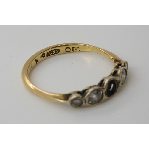 566 - An 18ct gold diamond ring (one diamond missing) the four remaining diamonds have an estimated diamon... 