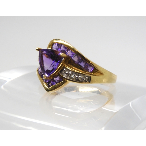 568 - A 9ct gold amethyst and diamond accent dress ring, size N1/2, weight 3.2gms