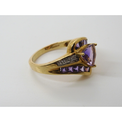 568 - A 9ct gold amethyst and diamond accent dress ring, size N1/2, weight 3.2gms