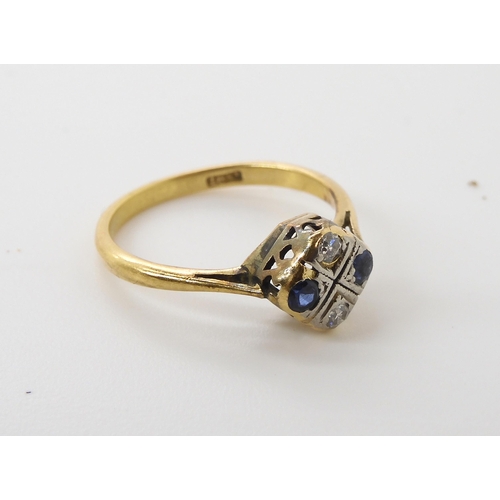 573 - An 18ct gold diamond and blue gem set vintage ring, size K, weight 2.1gms