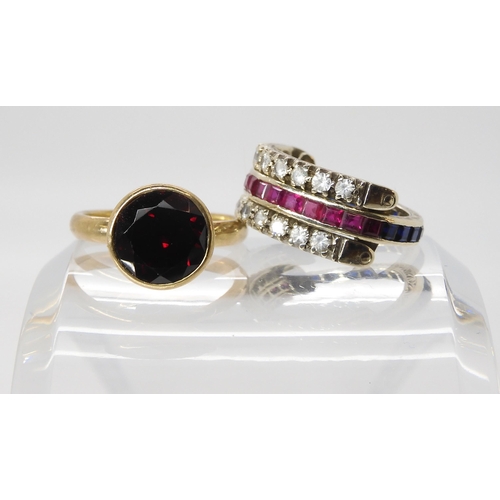 577 - A 9ct white gold clear, red and blue gem day and night ring, and a 9ct red gem set ring, weight toge... 