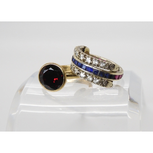 577 - A 9ct white gold clear, red and blue gem day and night ring, and a 9ct red gem set ring, weight toge... 