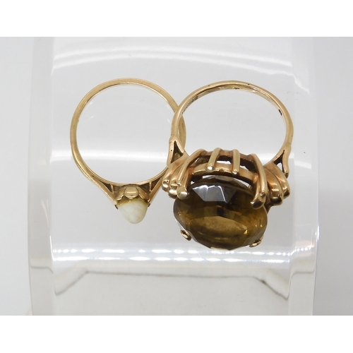 579 - A 9ct gold smoky quartz ring, size O1/2, and a 9ct pearl ring, size N1/2, weight combined 10.6gms