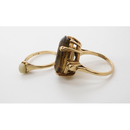 579 - A 9ct gold smoky quartz ring, size O1/2, and a 9ct pearl ring, size N1/2, weight combined 10.6gms