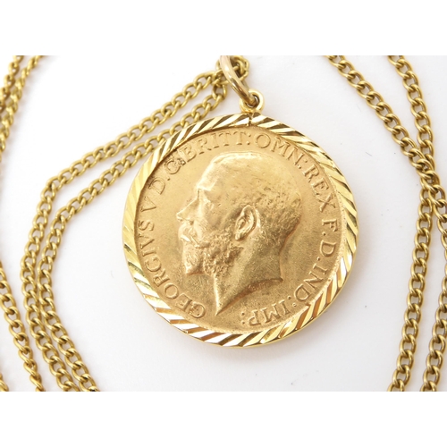 582 - A 1912 gold full sovereign in a 9ct pendant mount with yellow metal chain, weight combined 12.7gms