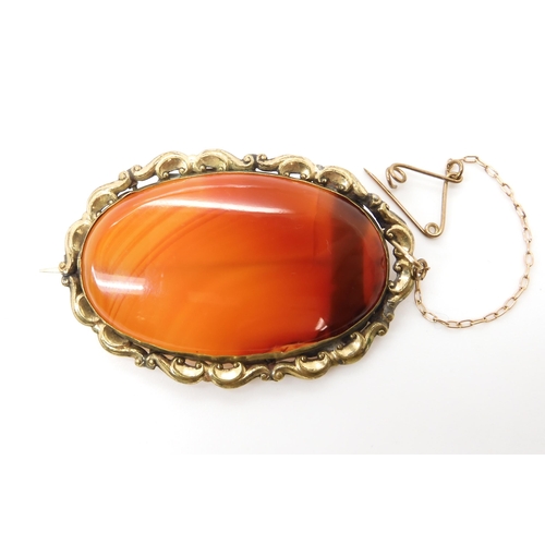 588 - A rolled gold carnelian brooch, weight 13.7gms